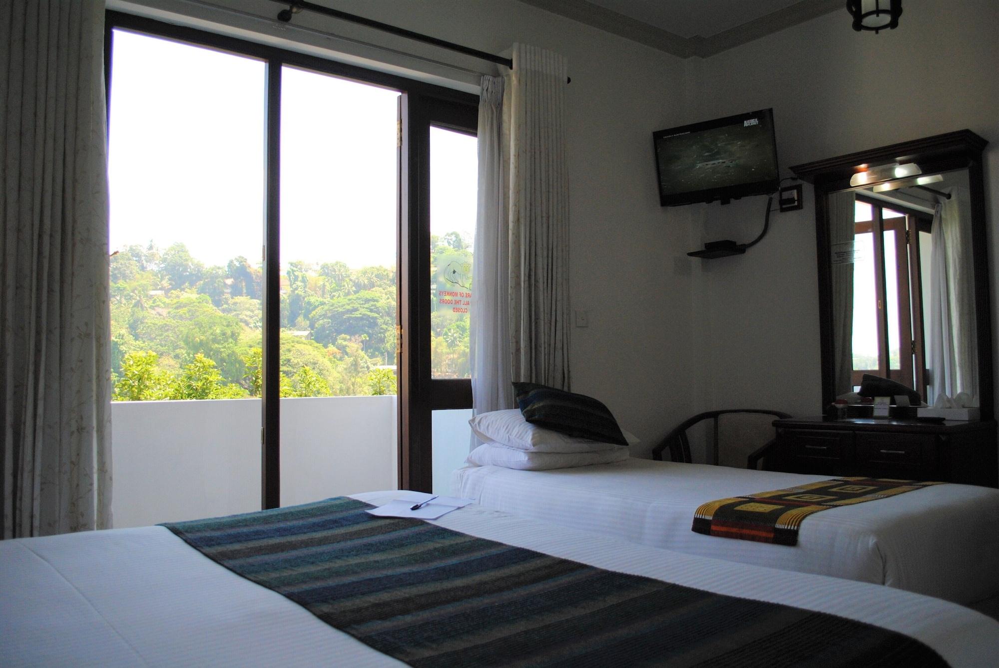 Quarto Triplo Deluxe com Varanda